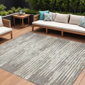 Photo of Taupe And Ivory Striped Washable Indoor Outdoor Area Rug