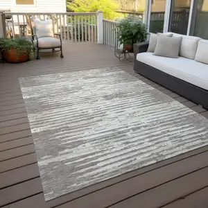 Photo of Taupe And Ivory Striped Washable Indoor Outdoor Area Rug