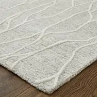 Photo of Taupe And Ivory Wool Abstract Tufted Handmade Stain Resistant Area Rug