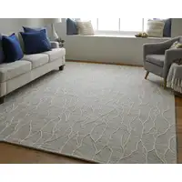 Photo of Taupe And Ivory Wool Abstract Tufted Handmade Stain Resistant Area Rug