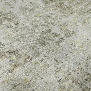 Photo of Taupe Beige And Gold Abstract Washable Area Rug With UV Protection