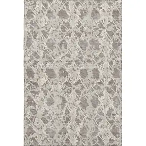 Photo of Taupe Beige And Ivory Abstract Washable Area Rug With UV Protection