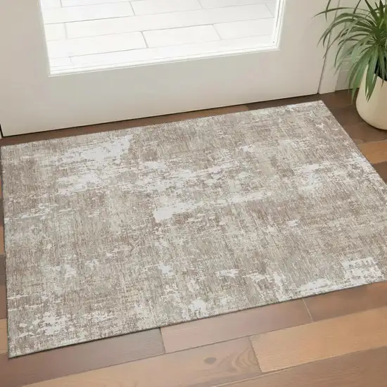 Taupe Beige And Ivory Abstract Washable Area Rug With UV Protection Photo 1