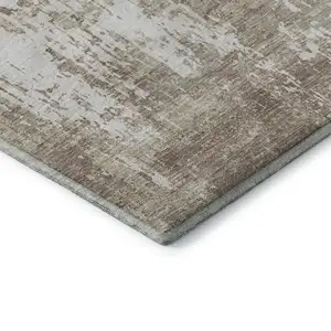 Photo of Taupe Beige And Ivory Abstract Washable Area Rug With UV Protection