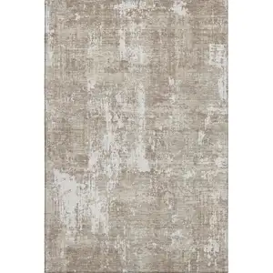 Photo of Taupe Beige And Ivory Abstract Washable Area Rug With UV Protection