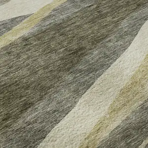 Photo of Taupe Beige And Ivory Abstract Washable Area Rug With UV Protection