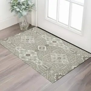 Photo of Taupe Beige And Ivory Floral Washable Area Rug With UV Protection