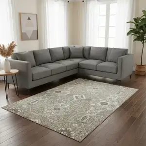 Photo of Taupe Beige And Ivory Floral Washable Area Rug With UV Protection