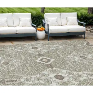Photo of Taupe Beige And Ivory Floral Washable Indoor Outdoor Area Rug