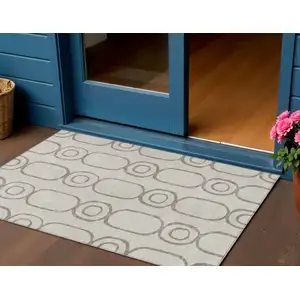 Photo of Taupe Beige And Ivory Geometric Washable Indoor Outdoor Area Rug