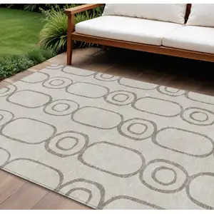 Photo of Taupe Beige And Ivory Geometric Washable Indoor Outdoor Area Rug