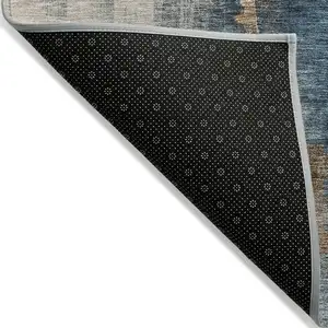 Photo of Taupe Black And Blue Abstract Washable Indoor Outdoor Area Rug