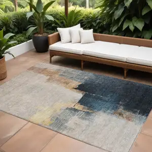 Photo of Taupe Black And Blue Abstract Washable Indoor Outdoor Area Rug