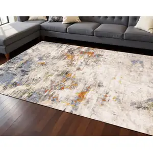 Photo of Taupe Blue And Copper Abstract Area Rug