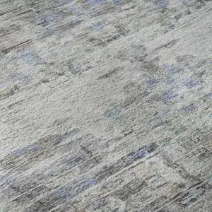 Photo of Taupe Blue And Gray Abstract Washable Area Rug With UV Protection