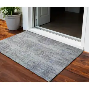 Photo of Taupe Blue And Green Abstract Washable Indoor Outdoor Area Rug