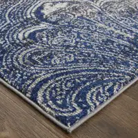 Photo of Taupe Blue And Ivory Abstract Power Loom Distressed Stain Resistant Area Rug