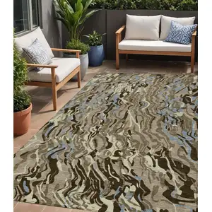Photo of Taupe Brown And Beige Abstract Washable Indoor Outdoor Area Rug