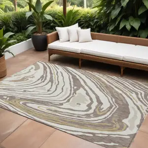 Photo of Taupe Brown And Beige Abstract Washable Indoor Outdoor Area Rug