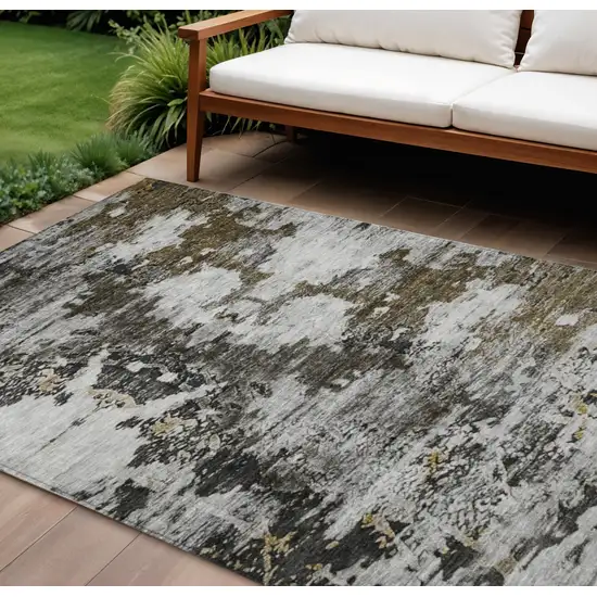 Taupe Brown And Gold Abstract Washable Indoor Outdoor Area Rug Photo 1