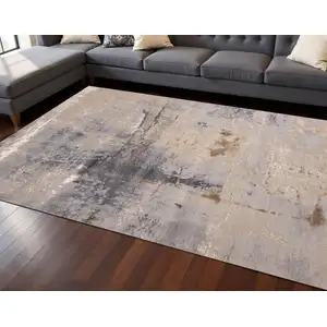 Photo of Taupe Brown And Gray Abstract Area Rug