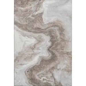 Photo of Taupe Brown And Ivory Abstract Washable Area Rug With UV Protection