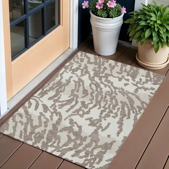 Taupe Brown And Ivory Animal Print Washable Indoor Outdoor Area Rug Photo 1