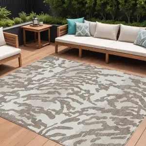 Photo of Taupe Brown And Ivory Animal Print Washable Indoor Outdoor Area Rug