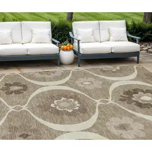 Photo of Taupe Brown And Ivory Medallion Washable Indoor Outdoor Area Rug