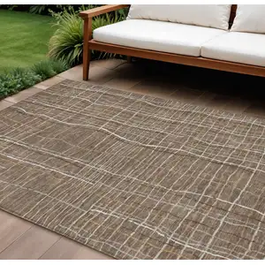 Photo of Taupe Brown And Ivory Striped Washable Indoor Outdoor Area Rug