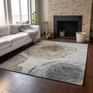 Photo of Taupe Brown And Ivory Woodland Lodge Washable Area Rug With UV Protection