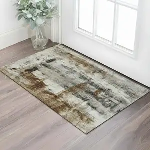 Photo of Taupe Charcoal And Brown Abstract Washable Area Rug With UV Protection