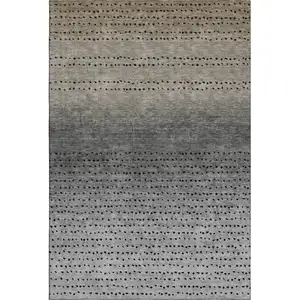 Photo of Taupe Charcoal And Gray Abstract Washable Area Rug With UV Protection