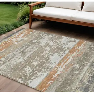 Photo of Taupe Copper And Ivory Striped Washable Indoor Outdoor Area Rug