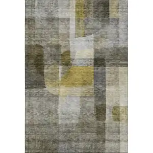 Photo of Taupe Gold And Gray Abstract Washable Area Rug With UV Protection