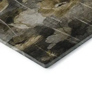 Photo of Taupe Gold And Ivory Floral Washable Area Rug With UV Protection