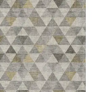 Photo of Taupe Gold And Ivory Geometric Washable Area Rug With UV Protection