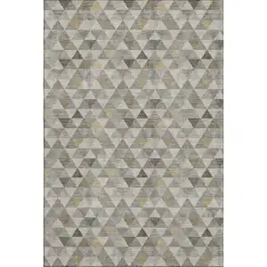 Photo of Taupe Gold And Ivory Geometric Washable Area Rug With UV Protection