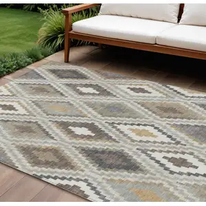 Photo of Taupe Gold And Ivory Geometric Washable Indoor Outdoor Area Rug