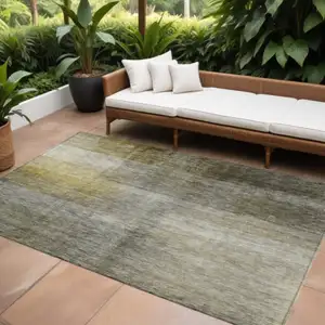 Photo of Taupe Gray And Black Abstract Washable Indoor Outdoor Area Rug