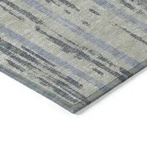 Photo of Taupe Gray And Blue Striped Washable Indoor Outdoor Area Rug