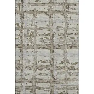 Photo of Taupe Gray And Brown Striped Washable Area Rug With UV Protection