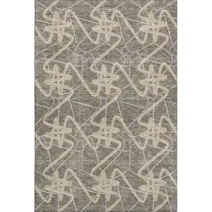 Photo of Taupe Gray And Gold Geometric Washable Area Rug With UV Protection