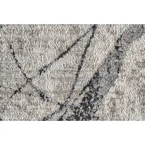 Photo of Taupe Gray And Ivory Abstract Stain Resistant Area Rug