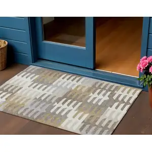 Photo of Taupe Gray And Ivory Geometric Washable Indoor Outdoor Area Rug