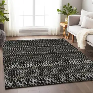 Photo of Taupe Gray And Ivory Striped Washable Area Rug With UV Protection