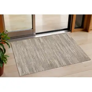 Photo of Taupe Gray And Ivory Striped Washable Indoor Outdoor Area Rug