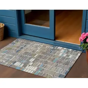 Photo of Taupe Ivory And Blue Abstract Washable Indoor Outdoor Area Rug