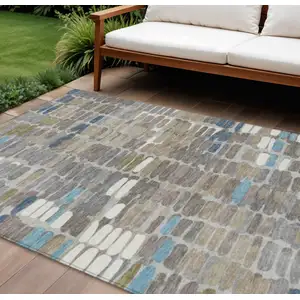 Photo of Taupe Ivory And Blue Abstract Washable Indoor Outdoor Area Rug