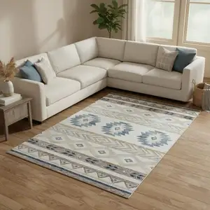 Photo of Taupe Ivory And Blue Geometric Washable Area Rug With UV Protection